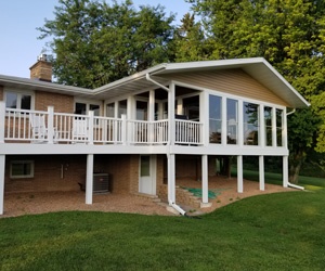 Raised porch and deck in back of house