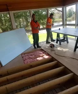 Workers working on floor insulation