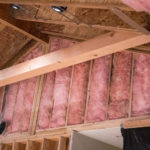 Fiberglass batt insulation installs in walls.