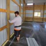 Worker in a large commercial space.