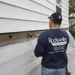 Man working on sidewall insulation project.