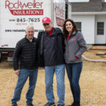 Three members of the Rockweiler Insulation team standing in front of a white house and company truck.