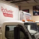 Rockweiler Insulation logo on two company trucks.