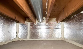 Inside a crawl space with insulation