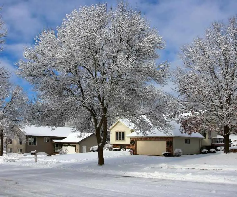Winter landscape with small town street view after blizzard.