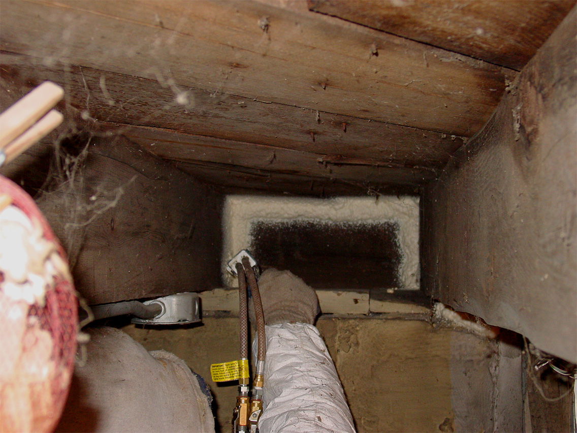Rockweiler Insulation spray foam air sealing at a rim joist in a Madison, WI basement.